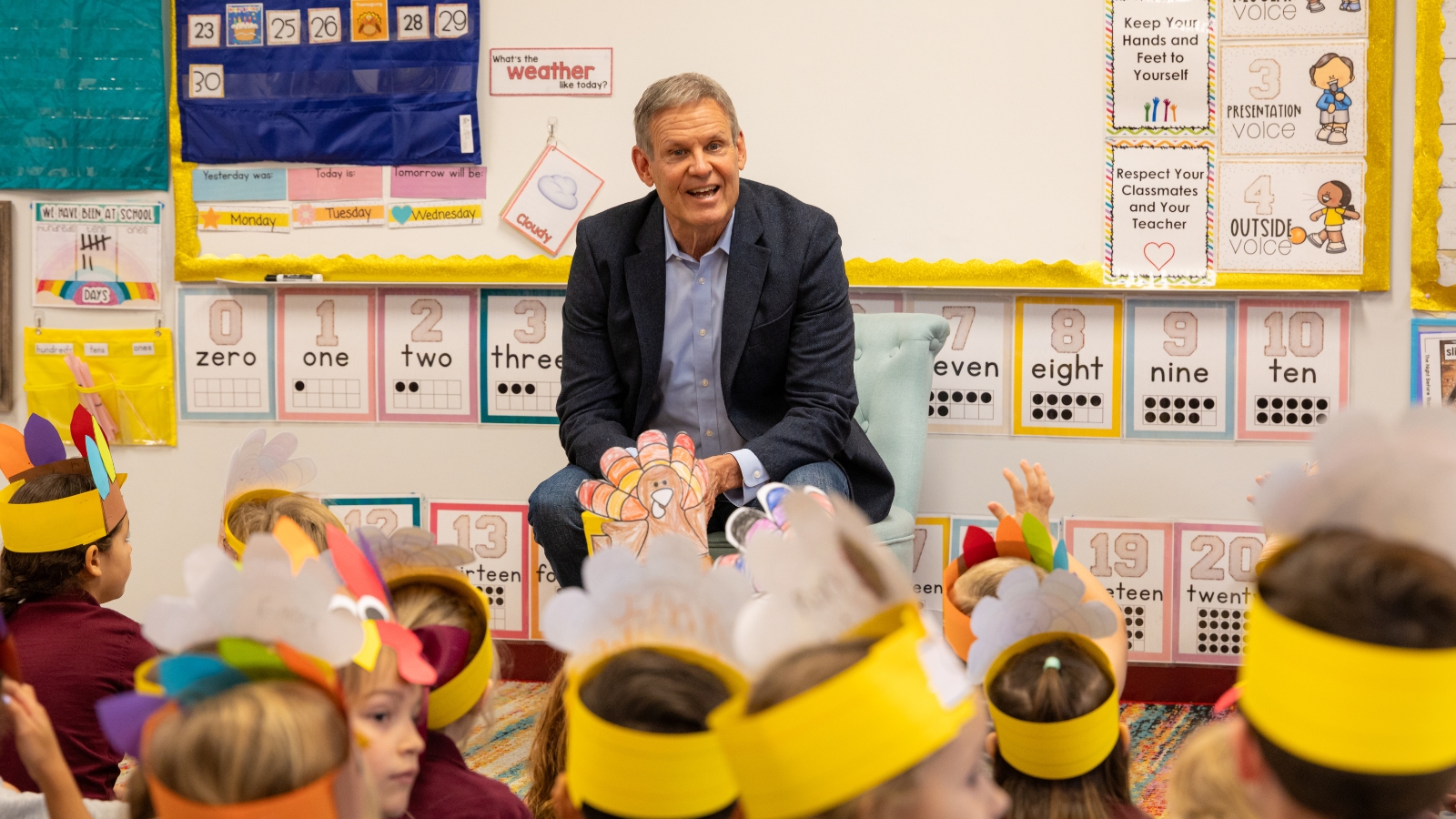 Governor Bill Lee speaking to Kindergarten class sitting on floor in front of him