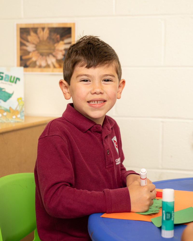 Pre-K student drawing with marker