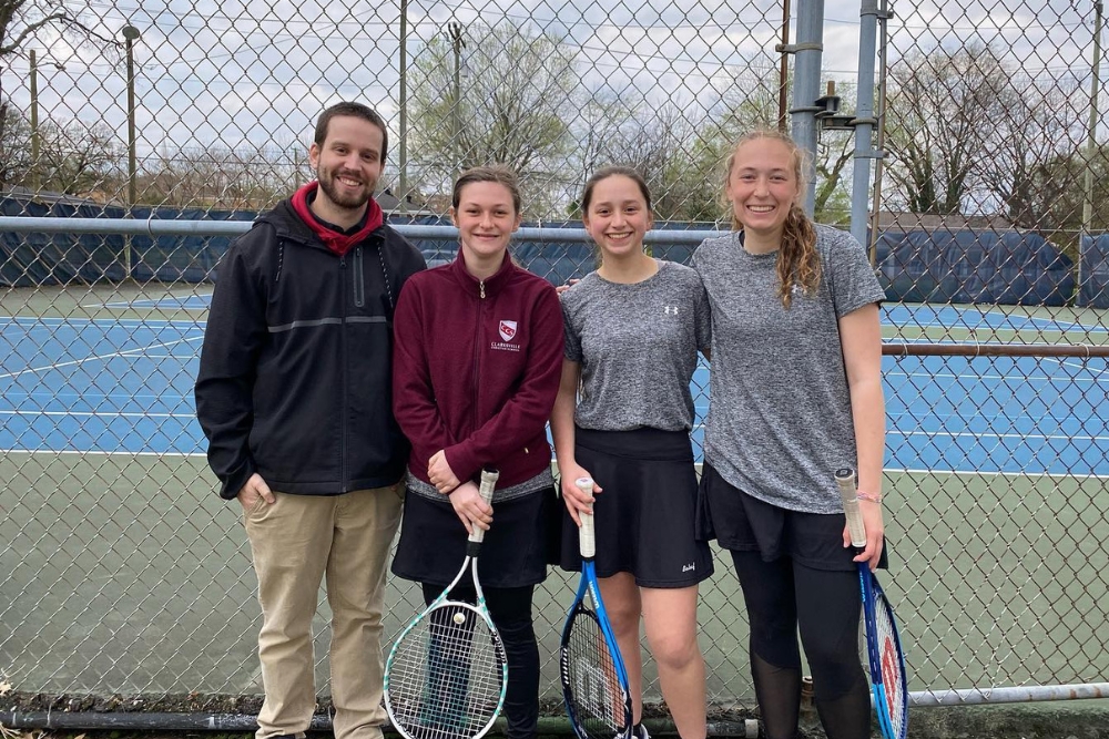 tennis team in front of court